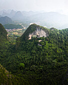 Aerial view of majestic karst mountains and lush green forests, Guilin, China.