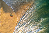 Aerial view of a person on the beach at Playa de los Amantes, Cabo San Lucas, Baja California, Mexico.