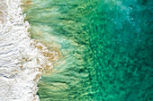 Aerial view of crispy waves along the shoreline at Playa de los Amantes, Cabo San Lucas, Baja California, Mexico.
