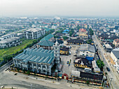 Aerial view of st cypran church amidst bustling cityscape and modern buildings, Port Harcourt, Nigeria.