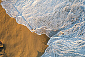 Aerial view of a person on the beach at Playa de los Amantes, Cabo San Lucas, Baja California, Mexico.