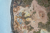 Aerial view of a coastline along the lakefront at Gunnuhver Hot Springs (Geo Thermal Hot Spring), Grindavík, Iceland.