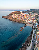 Aerial view of the picturesque coastal town with beautiful buildings along the shore and the Mediterranean Sea, Castelsardo, Italy.