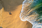 Aerial view of a person on the beach at Playa de los Amantes, Cabo San Lucas, Baja California, Mexico.