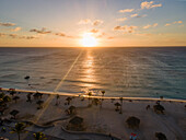 Aerial view of Arashi Beach at sunset in Aruba.