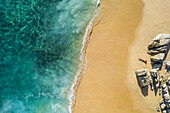 Aerial view of a person on the beach at Playa de los Amantes, Cabo San Lucas, Baja California, Mexico.