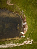 Aerial view of small wooden boat moored on a small beach on island Vormsi in Estonia.