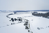 Aerial view of nordic snowy landscape in Estonia.
