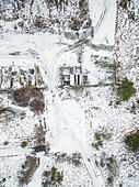 Aerials view of car's tracks in snow in countryside of Estonia.