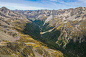 Aerial view of snowy Alps crest in Saint Arnaud, Tasman, New Zealand, overlooking Travers river.