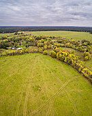 Aerial view of pathway patterns in the green field on the island of Vormsi, Estonia