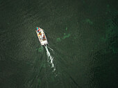 Aerial view of a family in a boat in Baltic sea in Estonia.