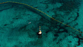 Aerial view of Cottesloe Beach with shark net and turquoise ocean, Perth, Australia.