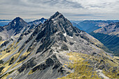 Aerial view of snowy Angelus peak in Nelson Lakes National Park, Tasman, New Zealand.