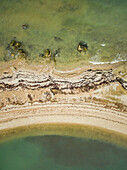 Abstract aerial view of peninsula part in gree sea in Estonia.