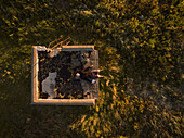 Aerial selfie of a man lying on a ruins in countryside of Estonia.