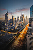 Dubai, United Arab Emirates - 17 February 2022: Aerial view of museum of the future at night with beautiful cityscape and modern skyscrapers, Dubai, United Arab Emirates.