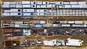 Aerial view of finished concrete slabs and related products at a concrete manufacturing facility in the afternoon sun in Aurora, IL, USA
