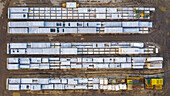 Aerial view of finished concrete slabs and related products at a concrete manufacturing facility in the afternoon sun in Aurora, IL, USA