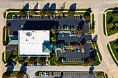 Aerial view of a parking lot busy of vehicles in a small residential park in Columbia, Missouri. United States of America