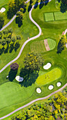 Aerial view of a golf course fairway and sand traps in autumn creating an abstract looking perspective at Arrowhead Golf Course in Wheaton, IL - USA