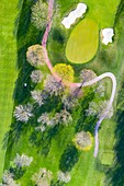 Aerial view of a golf course fairway and sand traps in early spring creating an abstract looking perspective at the Naperville Country Club in Napervile, IL - USA