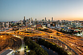 Aerial view of the Inner City Bypass & Airport Link highway interchange with Brisbane City in the background, Bowen Hills, Brisbane, Queensland, Australia.