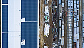Aerial view of finished concrete slabs and related products at a concrete manufacturing facility in the afternoon sun in Aurora, IL, USA