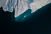 Aerial top-down drone view of an iceberg landscape structure at Ilulissat ice fjord, Greenland, Arctic.