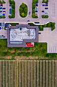 Aerial view of a small parking lot next to the vineyard near the Lake Ontario, Canada.