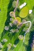 Aerial view of a golf course fairway and sand traps in early spring creating an abstract looking perspective at the Naperville Country Club in Napervile, IL - USA