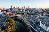 Panoramic aerial view of the Inner City Bypass & Airport Link highway interchange with Brisbane City in the background, Bowen Hills, Brisbane, Queensland, Australia.
