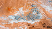 Aerial view of colorful geothermal area with unique rock formations and barren terrain, Myvatn, Iceland.