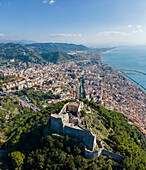 Panoramic aerial view of Arechi Castle on mountain top with Salerno downtown in background, Salerno, Campania, Italy.