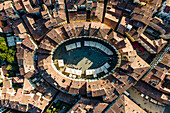 Aerial view of Piazza dell'Anfiteatro, a medieval square with cafè and market in Lucca old town, Tuscany, Italy.