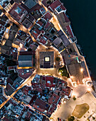Aerial top down view of Sitges city hall at sunset along the Mediterranean Sea, Barcelona, Spain.