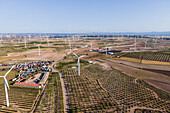 Aerial view of many wind turbines in a wind farm in countryside, La Muela, Zaragoza, Spain.