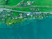 Aerial view of residential houses along Lake Lucerne at sunset, from Kussnacht am Rigi, Schwyz, Switzerland.