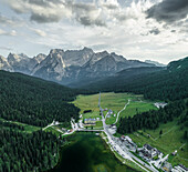 Panoramic aerial view of Misurina Lake at sunset with Sorapis mountain in background, Auronzo di Cadore, Dolomites, Veneto, Italy.