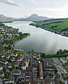 Aerial view of Kussnacht am Rigi town along Lake Lucerne with Mount Pilatus mountain peak in background, Alpnach, Switzerland.