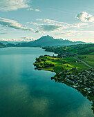 Aerial view of Mount Pilatus at sunset from Lake Lucerne, a mountain peak in Alpnach, Switzerland.