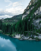 Aerial view of Braies Lake (Pragser Wildsee), a blue mountain lake on Fanes-Senes-Braies with Croda del Becco mountain in background, Dolomites, Trentino, South Tyrol, Italy.