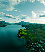 Aerial view of Mount Pilatus at sunset from Lake Lucerne, a mountain peak in Alpnach, Switzerland.