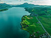 Aerial view of Mount Pilatus at sunset from Lake Lucerne, a mountain peak in Alpnach, Switzerland.