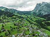 Aerial view of Grindelwald, a small town in the valley with the Wetterhorn mountain in background on the Swiss Alps, Canton of Bern, Switzerland.