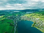 Aerial view of Kussnacht am Rigi, a small town along the Lake Lucerne at sunset with the Lake Zug (Zugersee) in background, Schwyz, Switzerland.