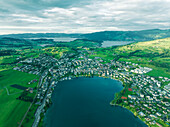 Aerial view of Kussnacht am Rigi, a small town along the Lake Lucerne at sunset with the Lake Zug (Zugersee) in background, Schwyz, Switzerland.