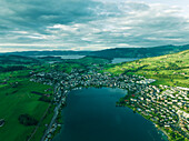 Aerial view of Kussnacht am Rigi, a small town along the Lake Lucerne at sunset with the Lake Zug (Zugersee) in background, Schwyz, Switzerland.