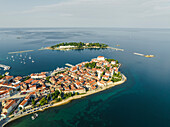 Aerial view of Porec and Otocic Sveti Nikola, a small island, a small town along the Adriatic Sea coastline in Istria, Croatia.