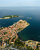 Aerial view of Porec at sunrise, a small town along the Adriatic Sea coastline in Istria, Croatia.